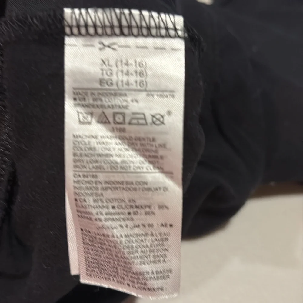 Old navy girls leggings.  size XL (14-16). Black and black with flowers